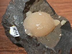 Calcite xx (yellow balls in basaltic matrix)