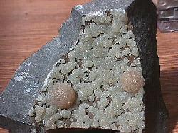 Calcite xx (Yellow balls in Basaltic matrix)